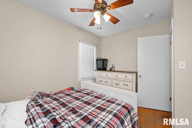 bedroom featuring ceiling fan and wood finished floors