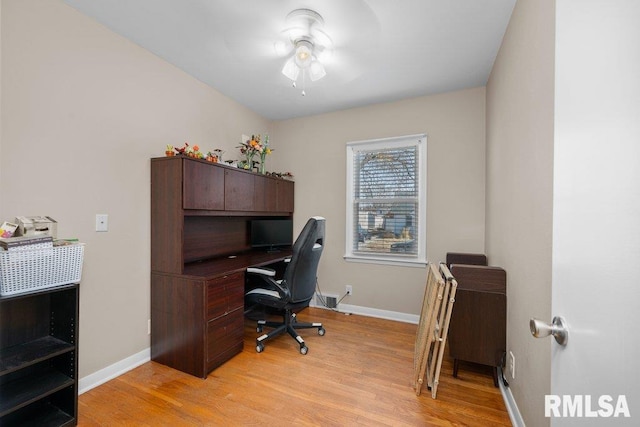 office featuring light wood-type flooring and baseboards