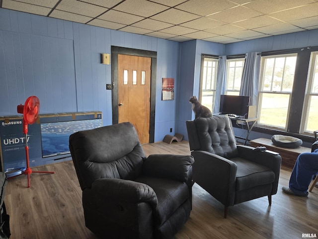 sitting room featuring a paneled ceiling and wood finished floors