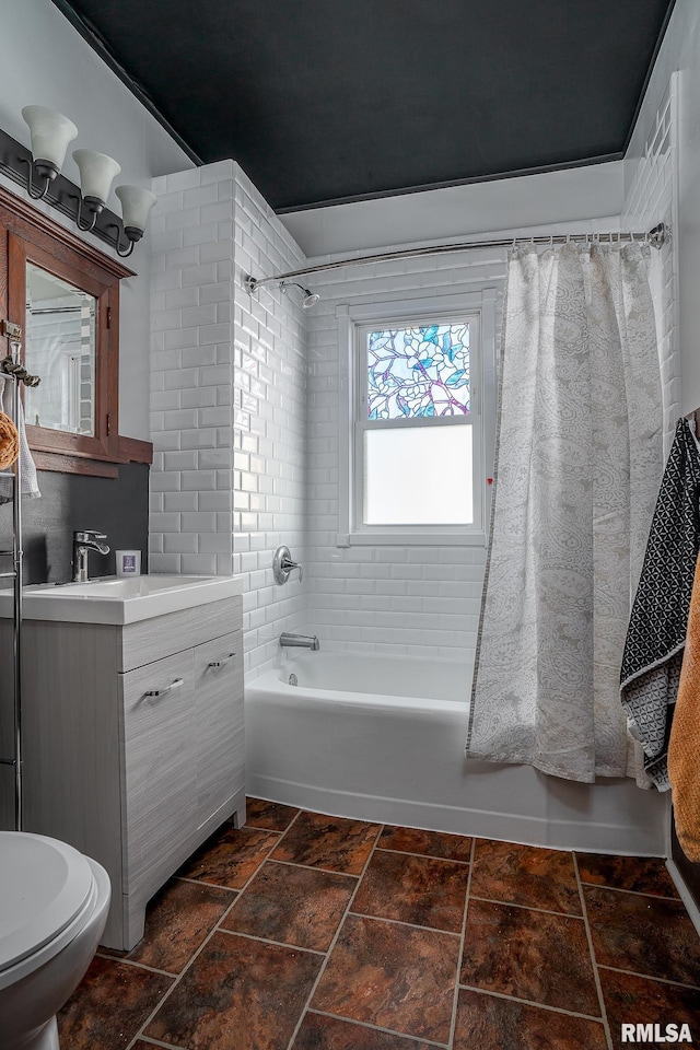 bathroom featuring toilet, shower / tub combo, and vanity