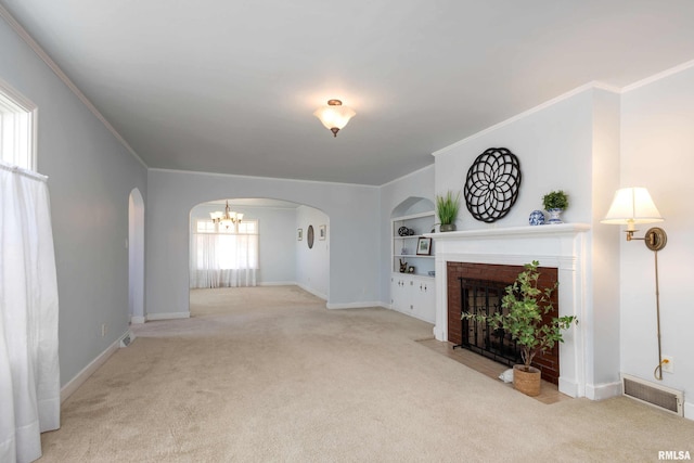 unfurnished living room featuring carpet floors, arched walkways, visible vents, and a fireplace with flush hearth