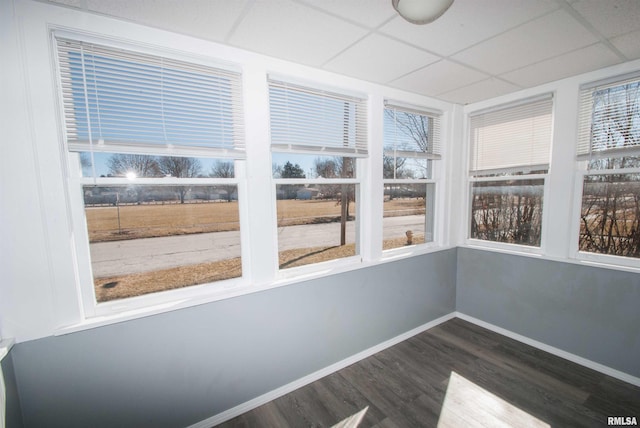 unfurnished sunroom featuring a paneled ceiling