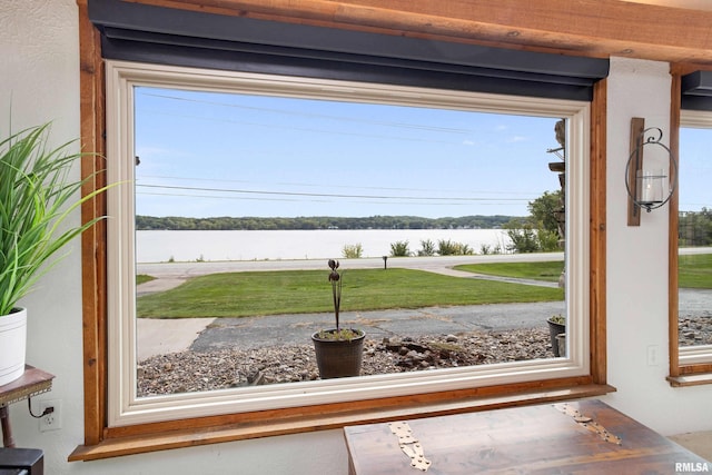 entryway with a water view and plenty of natural light