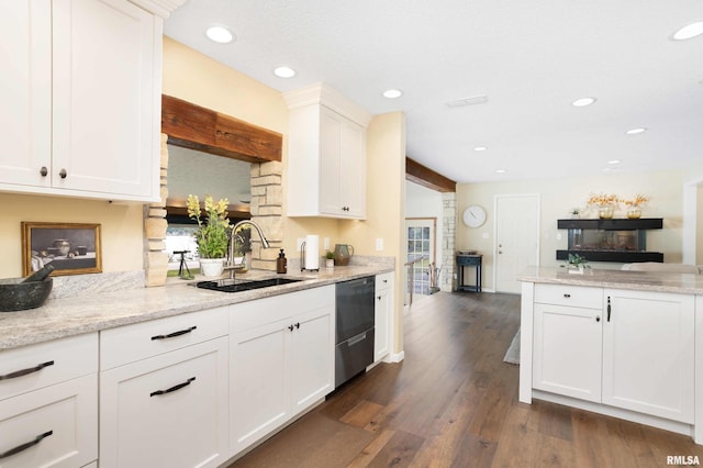 kitchen featuring dishwasher, a sink, white cabinets, and dark wood-style floors