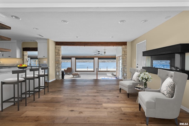 sitting room featuring wood finished floors and baseboards