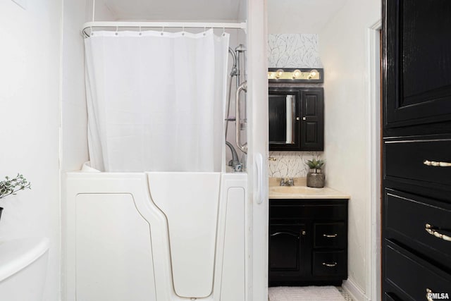 bathroom with toilet and vanity