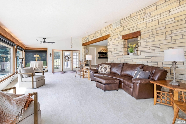 living room featuring french doors, carpet, and a ceiling fan