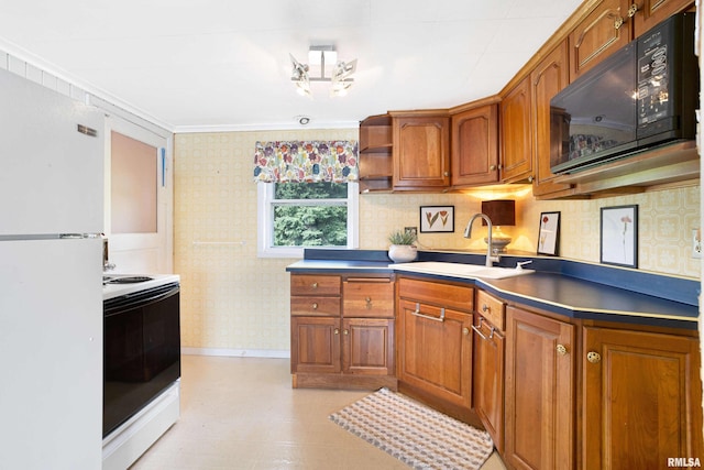 kitchen with light floors, brown cabinetry, a sink, white appliances, and wallpapered walls