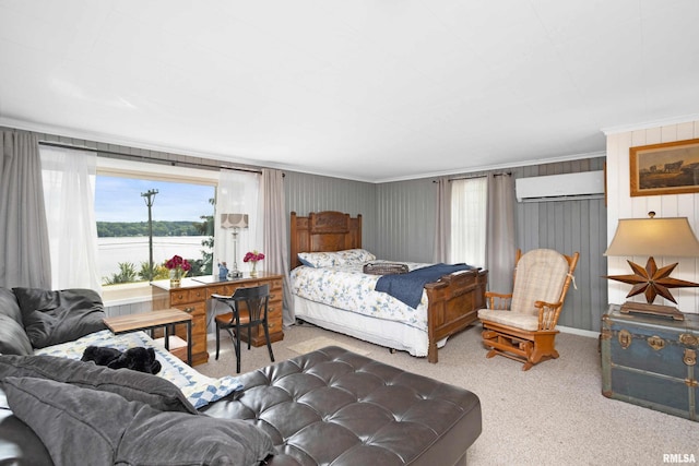 carpeted bedroom with crown molding and a wall mounted AC