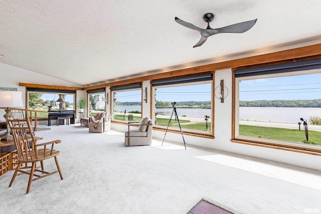 sunroom / solarium featuring lofted ceiling