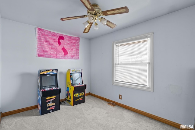 game room with carpet, visible vents, ceiling fan, and baseboards