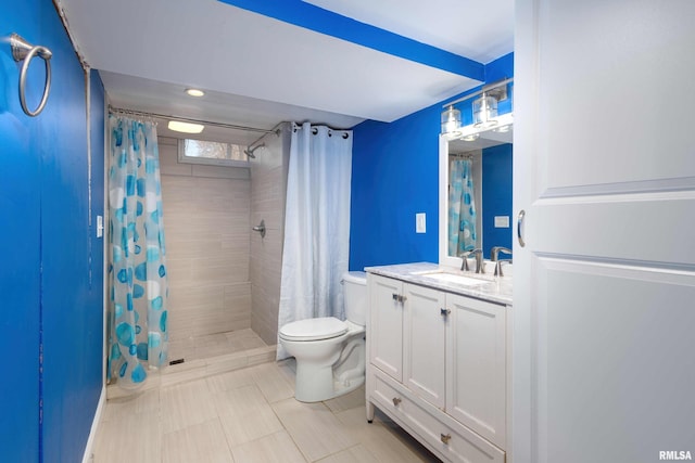 full bathroom with toilet, a tile shower, and vanity