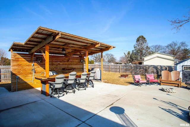 view of patio / terrace featuring a fenced backyard and outdoor dry bar