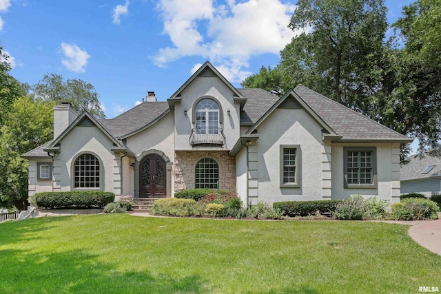 2 S Shore Ln, Rapids City, IL 61278 - french country home with stucco siding, a chimney, and a front lawn