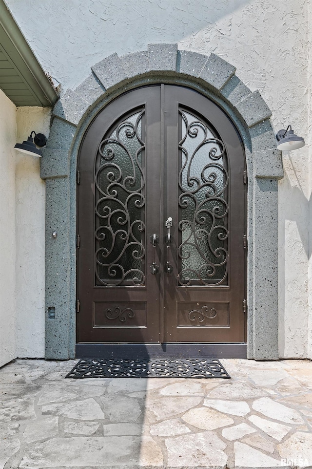 2 S Shore Ln, Rapids City, IL 61278 - doorway to property featuring stucco siding and a gate