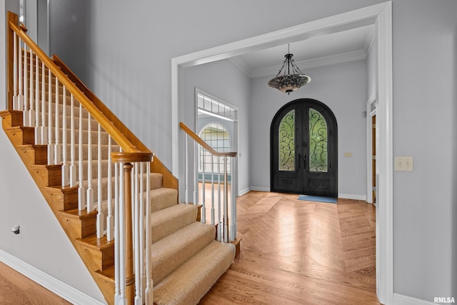 2 S Shore Ln, Rapids City, IL 61278 - foyer with french doors, ornamental molding, stairs, and arched walkways