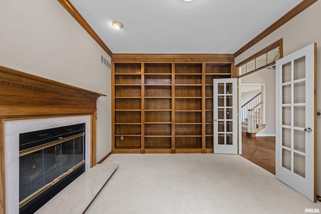 2 S Shore Ln, Rapids City, IL 61278 - unfurnished living room featuring french doors, crown molding, carpet floors, and a glass covered fireplace