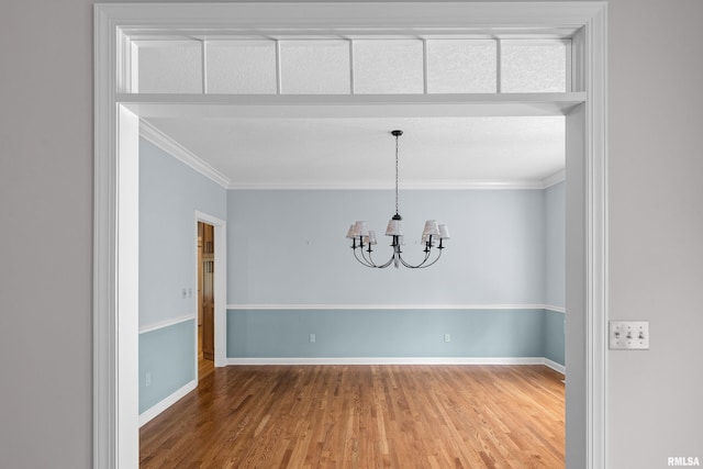 2 S Shore Ln, Rapids City, IL 61278 - empty room with a chandelier, wood finished floors, and ornamental molding