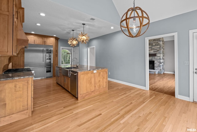 2 S Shore Ln, Rapids City, IL 61278 - kitchen with a chandelier, stainless steel appliances, an island with sink, light wood-style floors, and recessed lighting