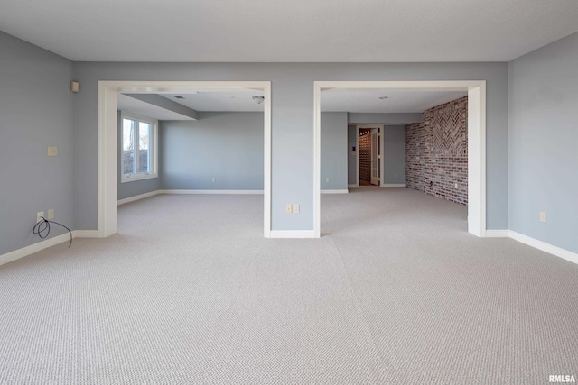 interior space with carpet and baseboards