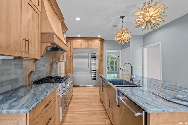 2 S Shore Ln, Rapids City, IL 61278 - kitchen featuring high quality appliances, light wood-style floors, a chandelier, light stone countertops, and backsplash
