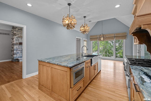 2 S Shore Ln, Rapids City, IL 61278 - kitchen with a chandelier, stainless steel appliances, stone countertops, light wood finished floors, and vaulted ceiling