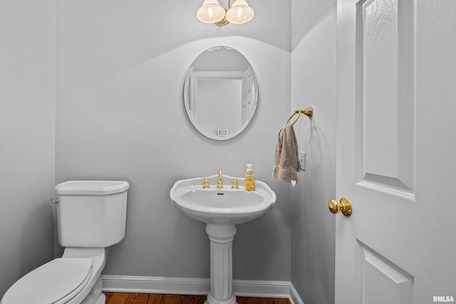 2 S Shore Ln, Rapids City, IL 61278 - half bathroom featuring toilet and wood finished floors