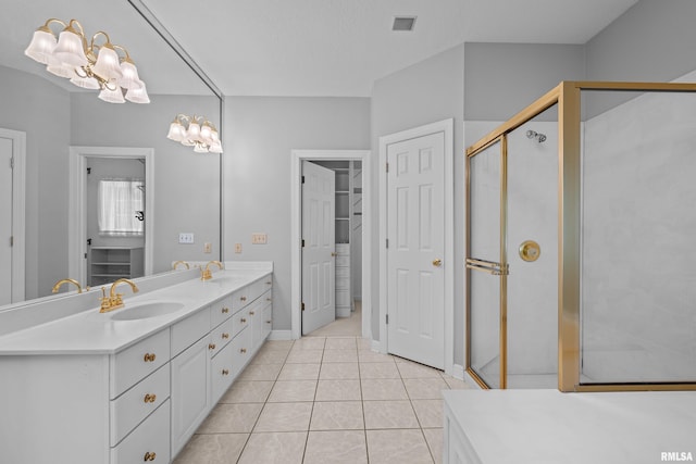 2 S Shore Ln, Rapids City, IL 61278 - bathroom featuring double vanity, tile patterned floors, a shower stall, and a chandelier