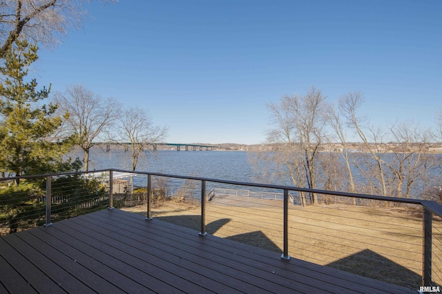 wooden terrace featuring a water view