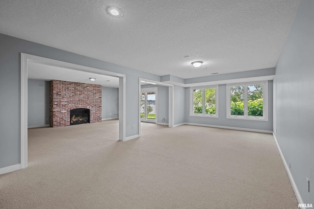 2 S Shore Ln, Rapids City, IL 61278 - unfurnished living room with a textured ceiling, carpet, and a brick fireplace