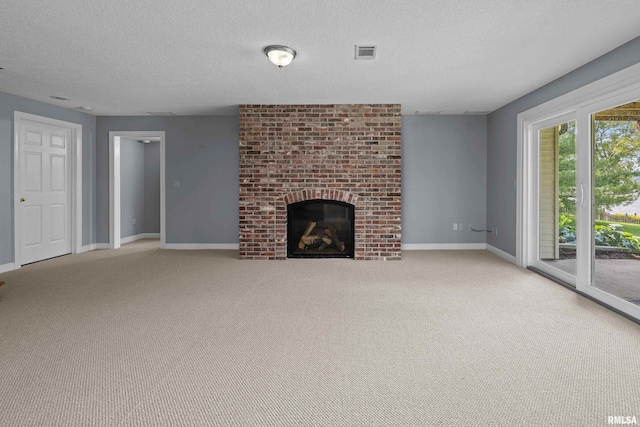 2 S Shore Ln, Rapids City, IL 61278 - unfurnished living room with a fireplace, a textured ceiling, and light colored carpet