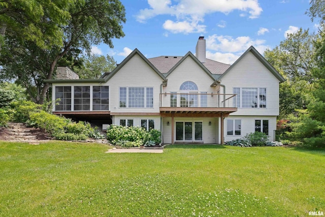 2 S Shore Ln, Rapids City, IL 61278 - rear view of property with a chimney, a yard, and a sunroom