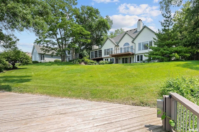 2 S Shore Ln, Rapids City, IL 61278 - back of property with a deck, a yard, and a chimney
