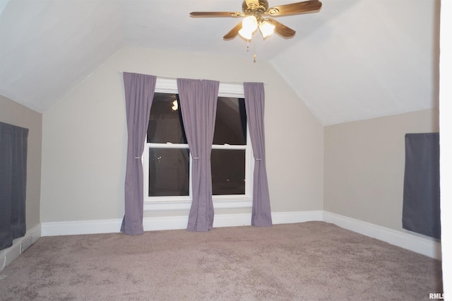 additional living space featuring lofted ceiling, carpet flooring, ceiling fan, and baseboards