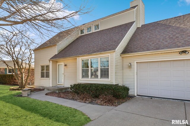 view of front of property featuring an attached garage, a shingled roof, a chimney, and a front yard