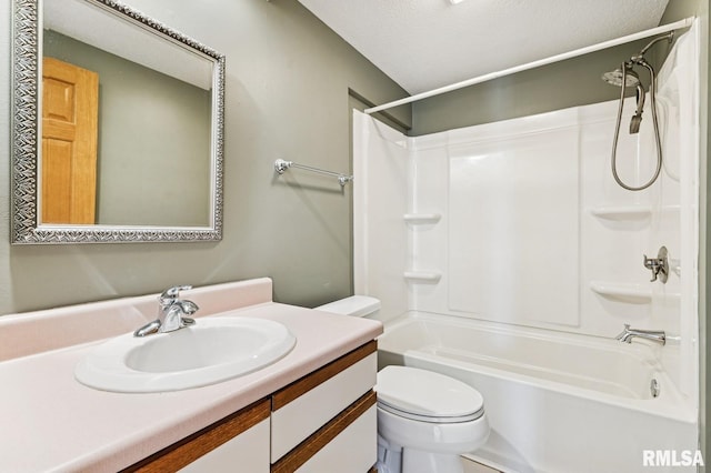 bathroom with shower / tub combination, vanity, and toilet