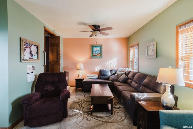 living area featuring ceiling fan