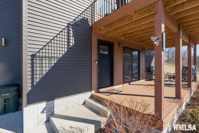 entrance to property featuring a patio area