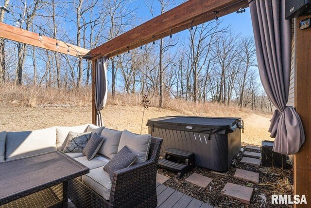 deck featuring a hot tub and an outdoor living space