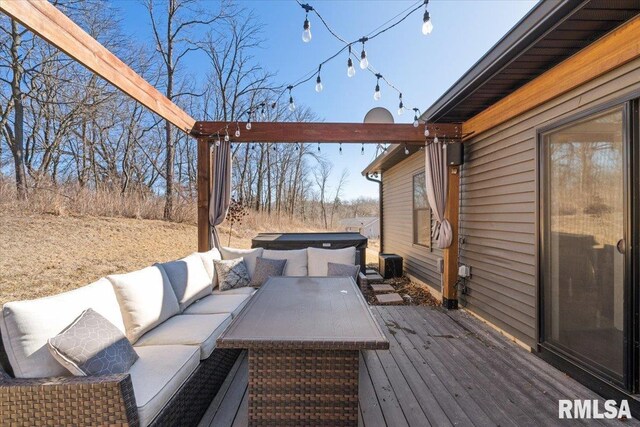 deck featuring central AC unit, outdoor lounge area, and a hot tub