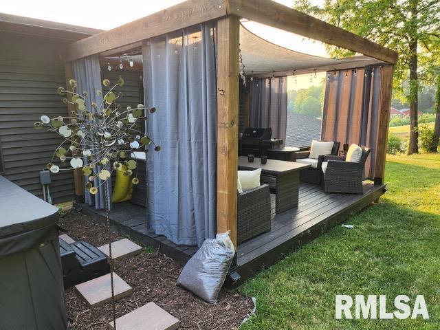 view of patio with grilling area, a wooden deck, and a jacuzzi