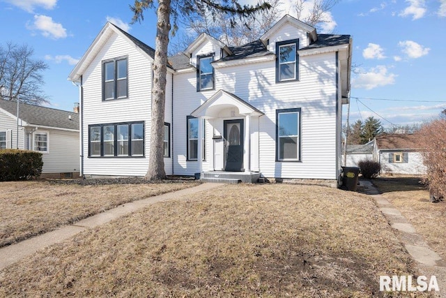 view of front facade with a front lawn