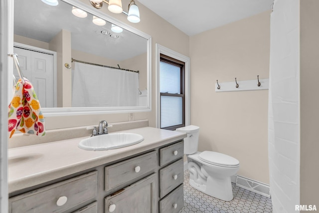 full bathroom with visible vents, toilet, vanity, baseboards, and tile patterned floors