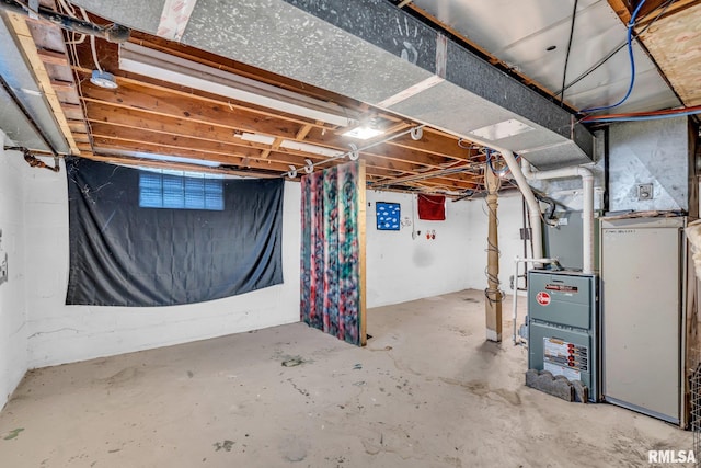 unfinished basement featuring heating unit