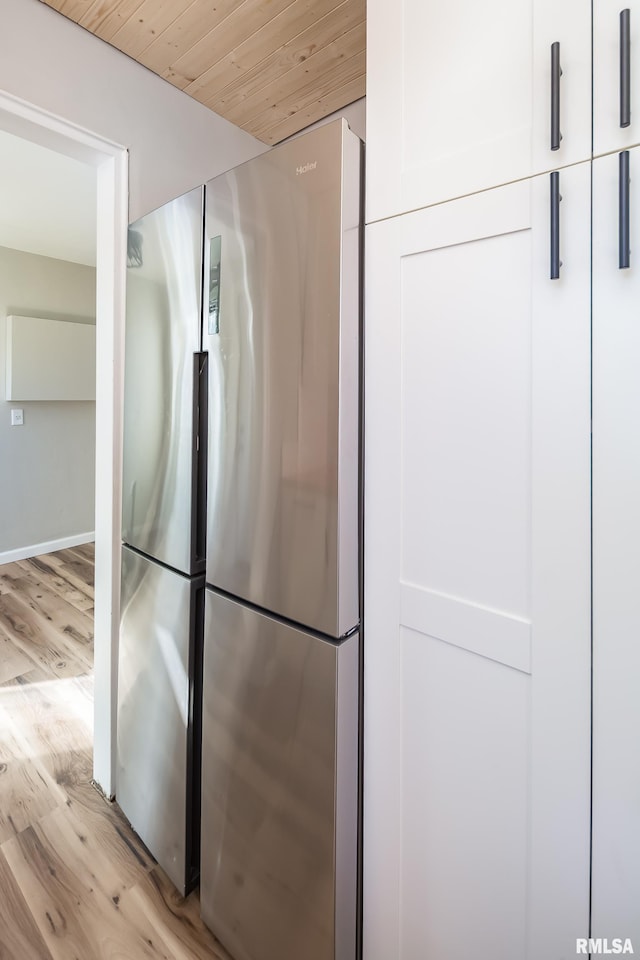 bathroom featuring wood ceiling and wood finished floors