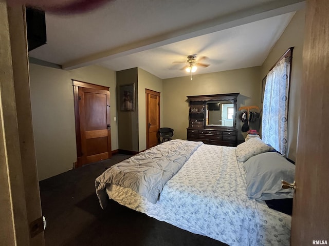 bedroom with beam ceiling, dark carpet, a ceiling fan, and baseboards