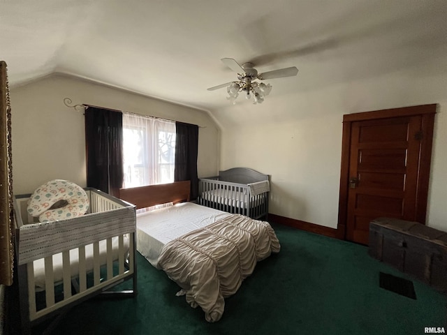 bedroom with lofted ceiling, baseboards, carpet floors, and a ceiling fan