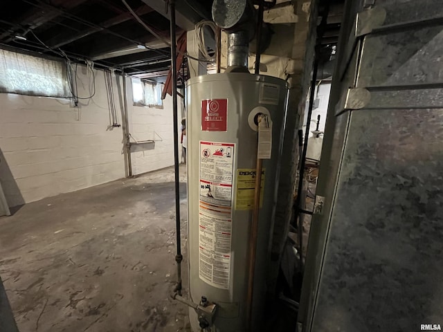 utility room with gas water heater