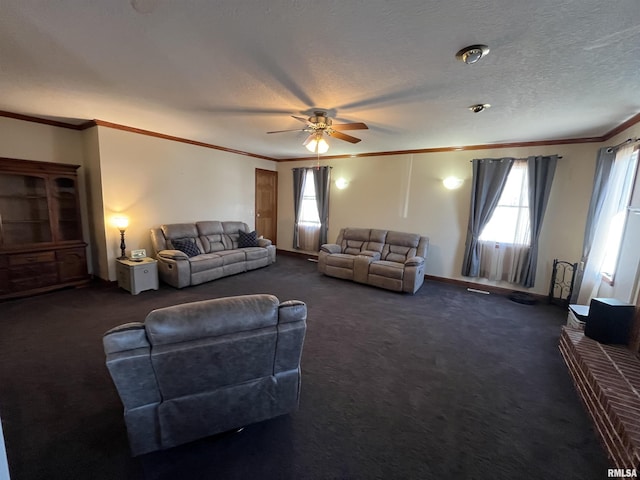 living area with ornamental molding, dark colored carpet, and a textured ceiling