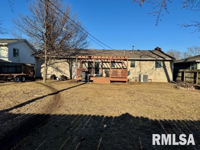 back of property with central air condition unit, fence, and a wooden deck